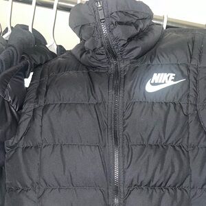 Black Nike vest with double zippers.